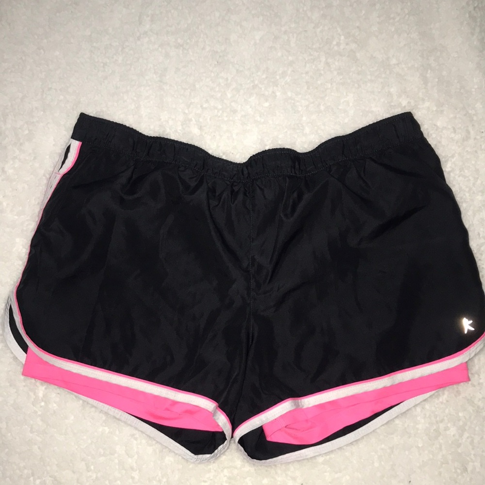 Black and pink athletic shorts